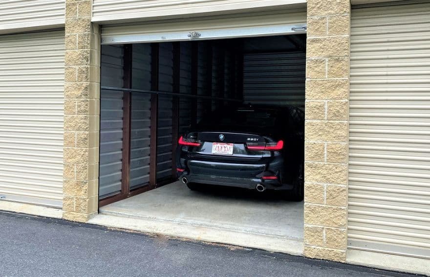 black car stored in a self storage unit