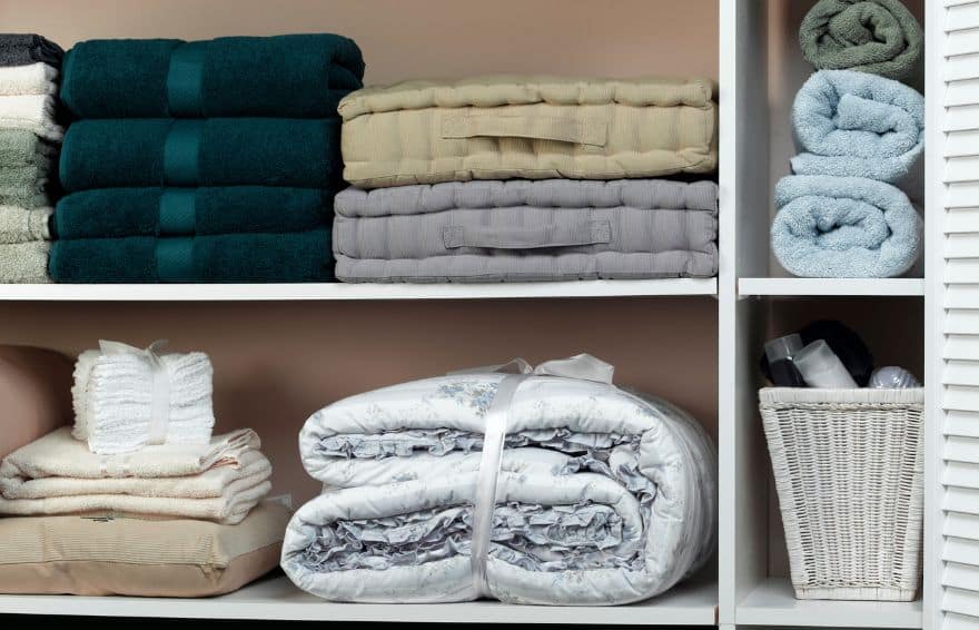 shelves filled with bedding and towels